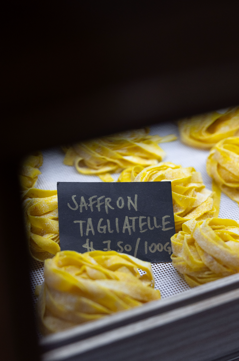 Jaffron tagliatelle pasta with a sign indicating price and weight.