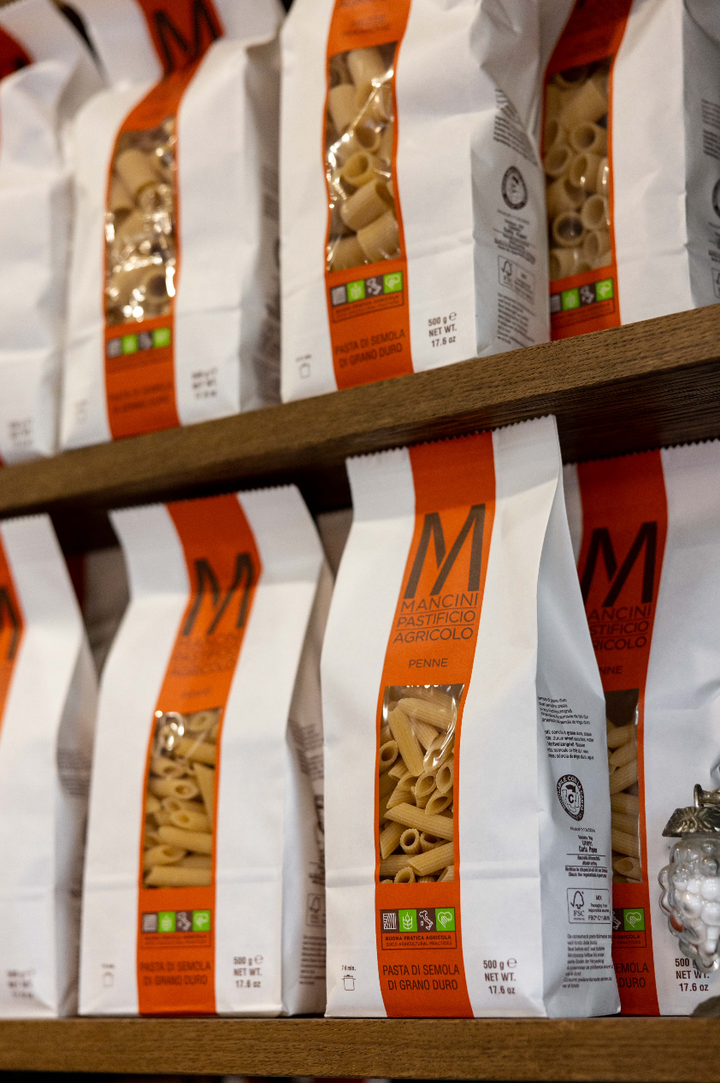 Pasta packages on a shelf with visible brand logo